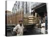 Truck Drivers in Front of Tea Sacks Being Unloaded at Kolkata Port-Eitan Simanor-Stretched Canvas