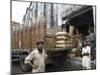 Truck Drivers in Front of Tea Sacks Being Unloaded at Kolkata Port-Eitan Simanor-Mounted Photographic Print