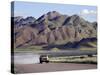 Truck Passing Through the Naukluft Mountains Near Solitaire, Namibia-Julian Love-Stretched Canvas