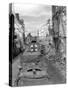 Trucks Driving Through the Ruined Town of Falaise-null-Stretched Canvas