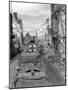 Trucks Driving Through the Ruined Town of Falaise-null-Mounted Photographic Print