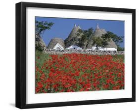 Trulli houses with red poppy field in foreground, near Alberobello, Apulia, Italy, Europe-Stuart Black-Framed Premium Photographic Print