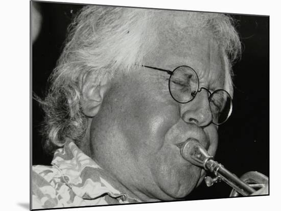 Trumpeter Henry Lowther Playing at the Fairway, Welwyn Garden City, Hertfordshire, 1 October 2000-Denis Williams-Mounted Photographic Print