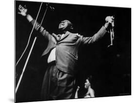 Trumpeter Louis Armstrong Belting Out His Famous Rendition of the Song "Hello Dolly" in a Nightclub-John Loengard-Mounted Premium Photographic Print