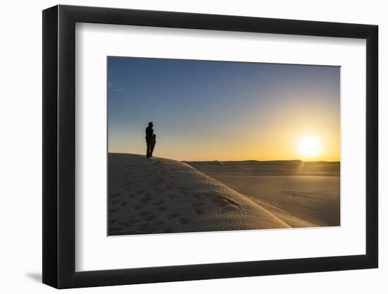 Tuareg standing on a sand dune in the Tenere Desert at sunrise, Sahara, Niger, Africa-Michael Runkel-Framed Photographic Print