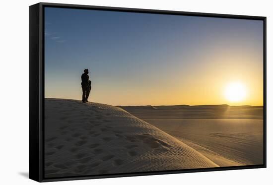 Tuareg standing on a sand dune in the Tenere Desert at sunrise, Sahara, Niger, Africa-Michael Runkel-Framed Stretched Canvas