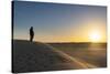 Tuareg standing on a sand dune in the Tenere Desert at sunrise, Sahara, Niger, Africa-Michael Runkel-Stretched Canvas