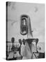 Tuba Player Keeping His Head Dry in a Rainstorm During Visit to St. Croix by Pres. Harry S. Truman-Thomas D^ Mcavoy-Stretched Canvas