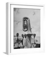 Tuba Player Keeping His Head Dry in a Rainstorm During Visit to St. Croix by Pres. Harry S. Truman-Thomas D^ Mcavoy-Framed Photographic Print