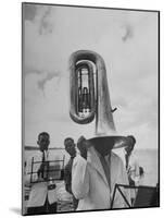 Tuba Player Keeping His Head Dry in a Rainstorm During Visit to St. Croix by Pres. Harry S. Truman-Thomas D^ Mcavoy-Mounted Photographic Print