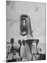 Tuba Player Keeping His Head Dry in a Rainstorm During Visit to St. Croix by Pres. Harry S. Truman-Thomas D^ Mcavoy-Mounted Photographic Print