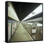 Tube Train Standing at Blackhorse Road Station on the Victoria Line, London, 1974-Michael Walters-Framed Stretched Canvas