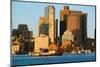 Tugboat with Boston Harbor and the Boston skyline at sunrise as seen from South Boston, Massachu...-null-Mounted Photographic Print