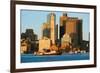 Tugboat with Boston Harbor and the Boston skyline at sunrise as seen from South Boston, Massachu...-null-Framed Photographic Print