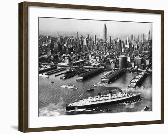 Tugboats Aid Ocean SS Queen Mary While Docking at 51st Street Pier with NYC Skyline in Background-null-Framed Photographic Print