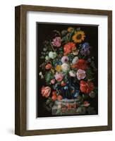 Tulips, a sunflower, an iris and numerous other flowers in a glass vase on marble column base-Jan Davidsz. de Heem-Framed Giclee Print