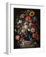 Tulips, a sunflower, an iris and numerous other flowers in a glass vase on marble column base-Jan Davidsz. de Heem-Framed Giclee Print