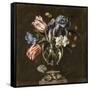 Tulips, Daffodils, Irises and Other Flowers in a Glass Vase on a Sculpted Stand, with a Butterfly-Juan de Arellano-Framed Stretched Canvas