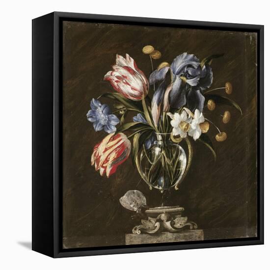 Tulips, Daffodils, Irises and Other Flowers in a Glass Vase on a Sculpted Stand, with a Butterfly-Juan de Arellano-Framed Stretched Canvas