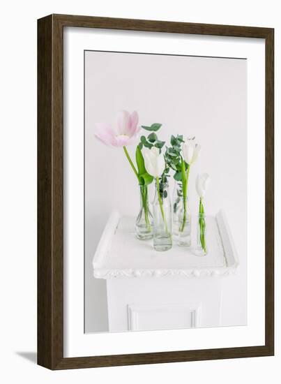 Tulips in Bottles on White Background Studio-Ihor Kopakov-Framed Photographic Print