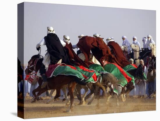 Tunisian Men Ride Their Arab Stallions During a Race the 36th Sahara Festival of Douz-null-Stretched Canvas