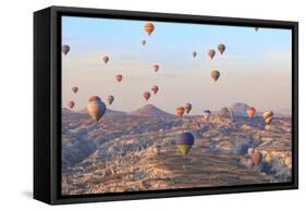 Turkey, Anatolia, Cappadocia, Goreme. Hot air balloons above Red Valley.-Emily Wilson-Framed Stretched Canvas
