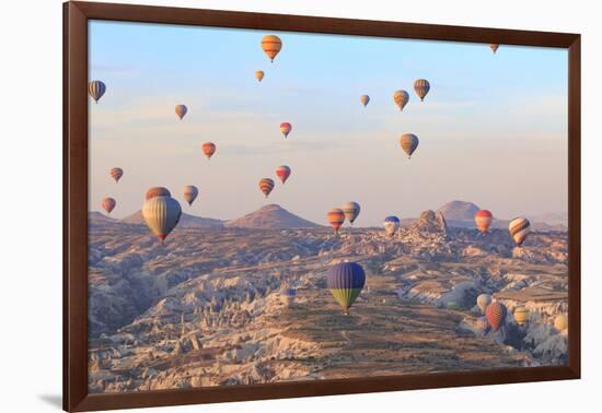 Turkey, Anatolia, Cappadocia, Goreme. Hot air balloons above Red Valley.-Emily Wilson-Framed Photographic Print