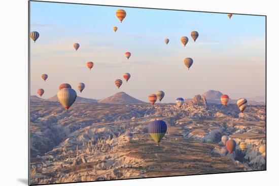 Turkey, Anatolia, Cappadocia, Goreme. Hot air balloons above Red Valley.-Emily Wilson-Mounted Photographic Print