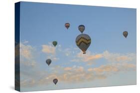 Turkey, Anatolia, Cappadocia, Goreme. Hot air balloons above Red Valley.-Emily Wilson-Stretched Canvas