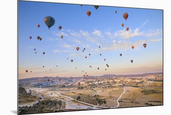 Turkey, Anatolia, Cappadocia, Goreme. Hot air balloons above Red Valley.-Emily Wilson-Mounted Premium Photographic Print