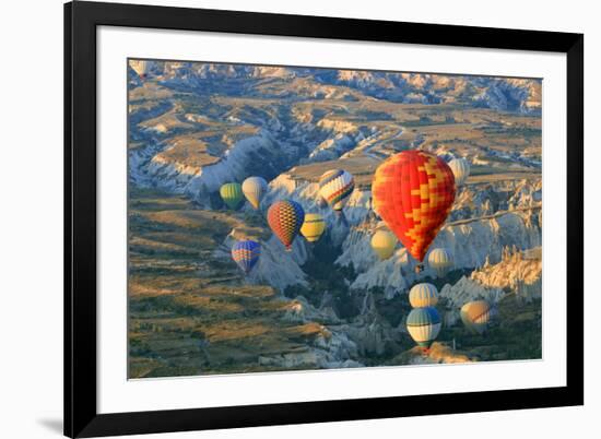 Turkey, Anatolia, Cappadocia, Goreme. Hot air balloons above Red Valley.-Emily Wilson-Framed Photographic Print