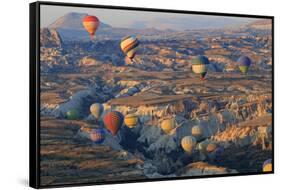 Turkey, Anatolia, Cappadocia, Goreme. Hot air balloons above Red Valley.-Emily Wilson-Framed Stretched Canvas