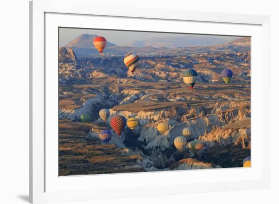Turkey, Anatolia, Cappadocia, Goreme. Hot air balloons above Red Valley.-Emily Wilson-Framed Premium Photographic Print