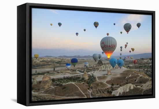 Turkey, Anatolia, Cappadocia, Goreme. Hot air balloons above Red Valley.-Emily Wilson-Framed Stretched Canvas