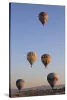 Turkey, Anatolia, Cappadocia, Goreme. Hot air balloons above Red Valley.-Emily Wilson-Stretched Canvas