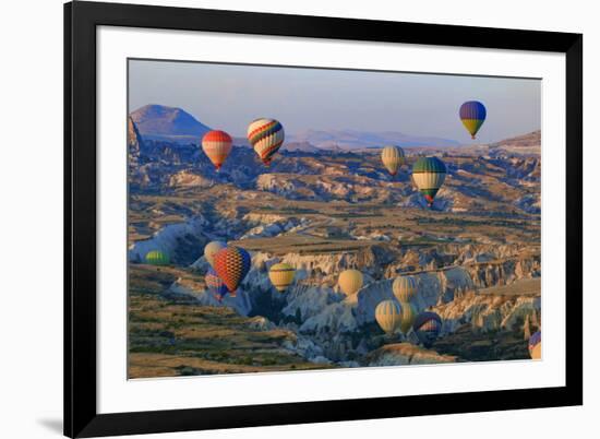 Turkey, Anatolia, Cappadocia, Goreme. Hot air balloons flying above the valley.-Emily Wilson-Framed Premium Photographic Print