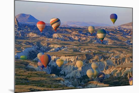 Turkey, Anatolia, Cappadocia, Goreme. Hot air balloons flying above the valley.-Emily Wilson-Mounted Premium Photographic Print