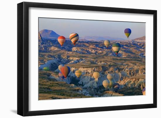 Turkey, Anatolia, Cappadocia, Goreme. Hot air balloons flying above the valley.-Emily Wilson-Framed Photographic Print