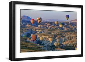 Turkey, Anatolia, Cappadocia, Goreme. Hot air balloons flying above the valley.-Emily Wilson-Framed Photographic Print