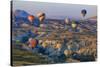 Turkey, Anatolia, Cappadocia, Goreme. Hot air balloons flying above the valley.-Emily Wilson-Stretched Canvas