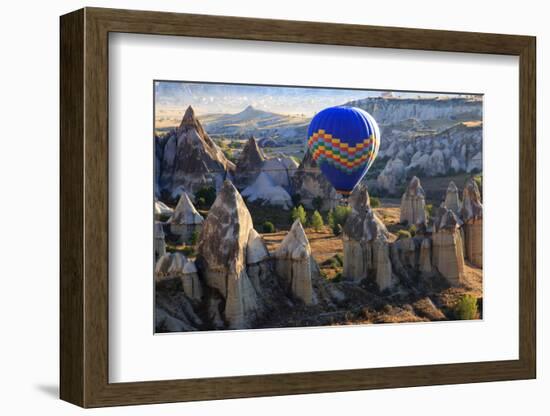 Turkey, Anatolia, Cappadocia, Goreme. Hot air balloons flying above the valley.-Emily Wilson-Framed Photographic Print