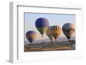 Turkey, Anatolia, Cappadocia, Goreme. Hot air balloons flying above the valley.-Emily Wilson-Framed Photographic Print