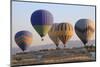 Turkey, Anatolia, Cappadocia, Goreme. Hot air balloons flying above the valley.-Emily Wilson-Mounted Photographic Print