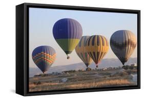 Turkey, Anatolia, Cappadocia, Goreme. Hot air balloons flying above the valley.-Emily Wilson-Framed Stretched Canvas