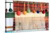 Turkey, Izmir, Selcuk, weaving loom with balls of wool or yarn.-Emily Wilson-Stretched Canvas