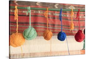 Turkey, Izmir, Selcuk, weaving loom with balls of wool or yarn.-Emily Wilson-Stretched Canvas