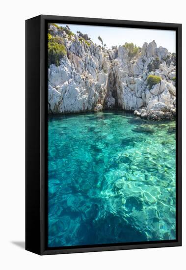 Turquoise colored crystal clear water at a rocky island, Aegean Sea, Turkey-Ali Kabas-Framed Stretched Canvas