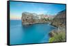 Turquoise sea at sunset framed by the old town perched on the rocks, Polignano a Mare, Province of -Roberto Moiola-Framed Stretched Canvas