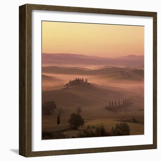 Tuscan farmhouse with cypress trees in misty landscape at sunrise, San Quirico d'Orcia-Stuart Black-Framed Photographic Print