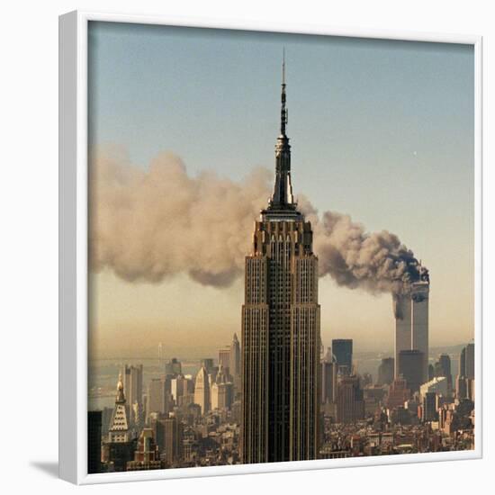 Twin Towers of the World Trade Center Burn Behind the Empire State Buildiing, September 11, 2001-null-Framed Photographic Print